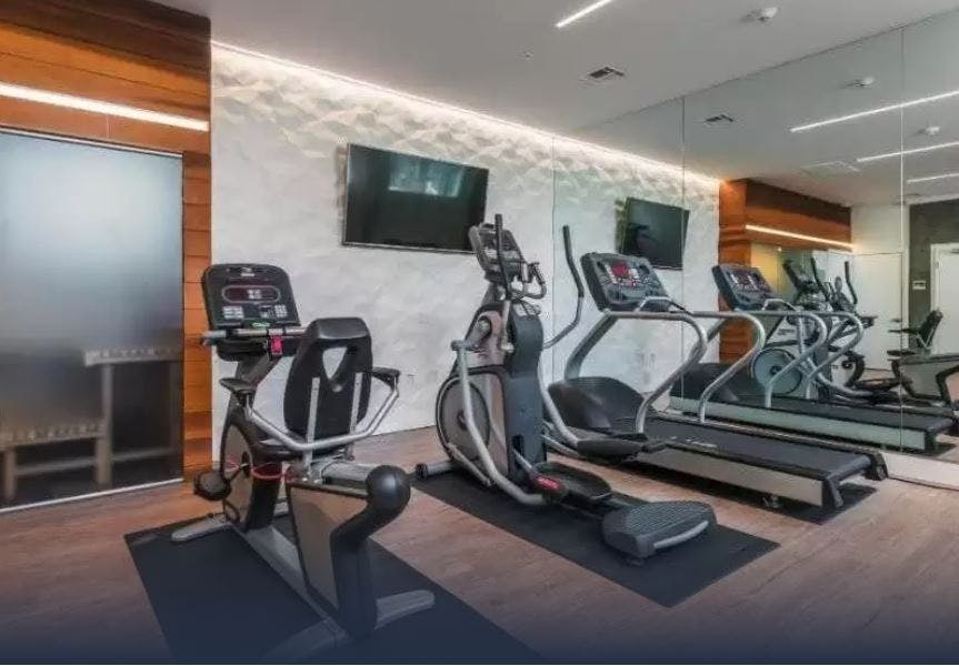 The Crimson offers amenities such as a fitness center, on-site retail, balconies in the residences, and a spa suite.