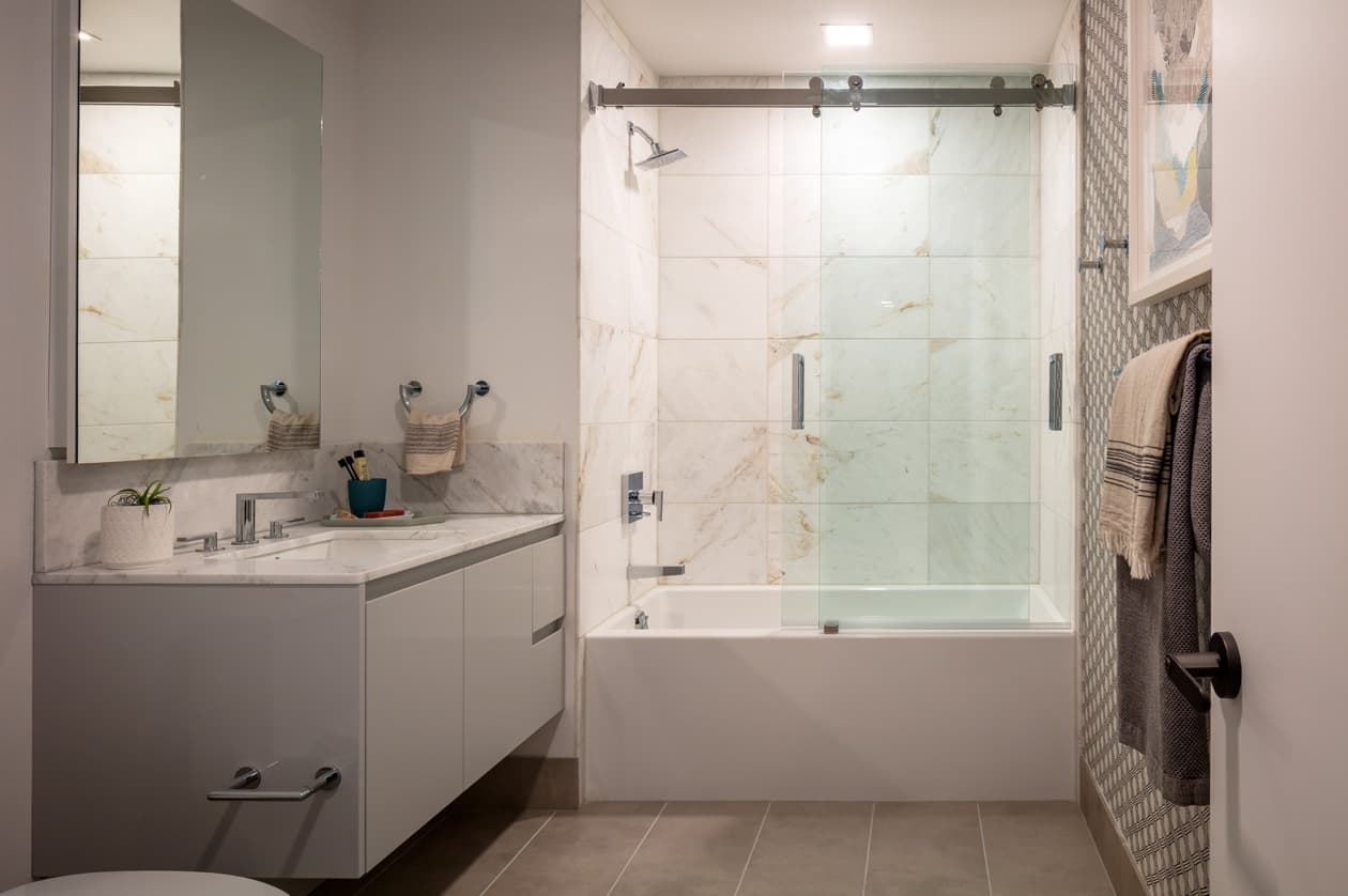 With clean tiled floors and shower walls, as well as a floating mirror, the bathrooms are elegant and classy in appearance. 