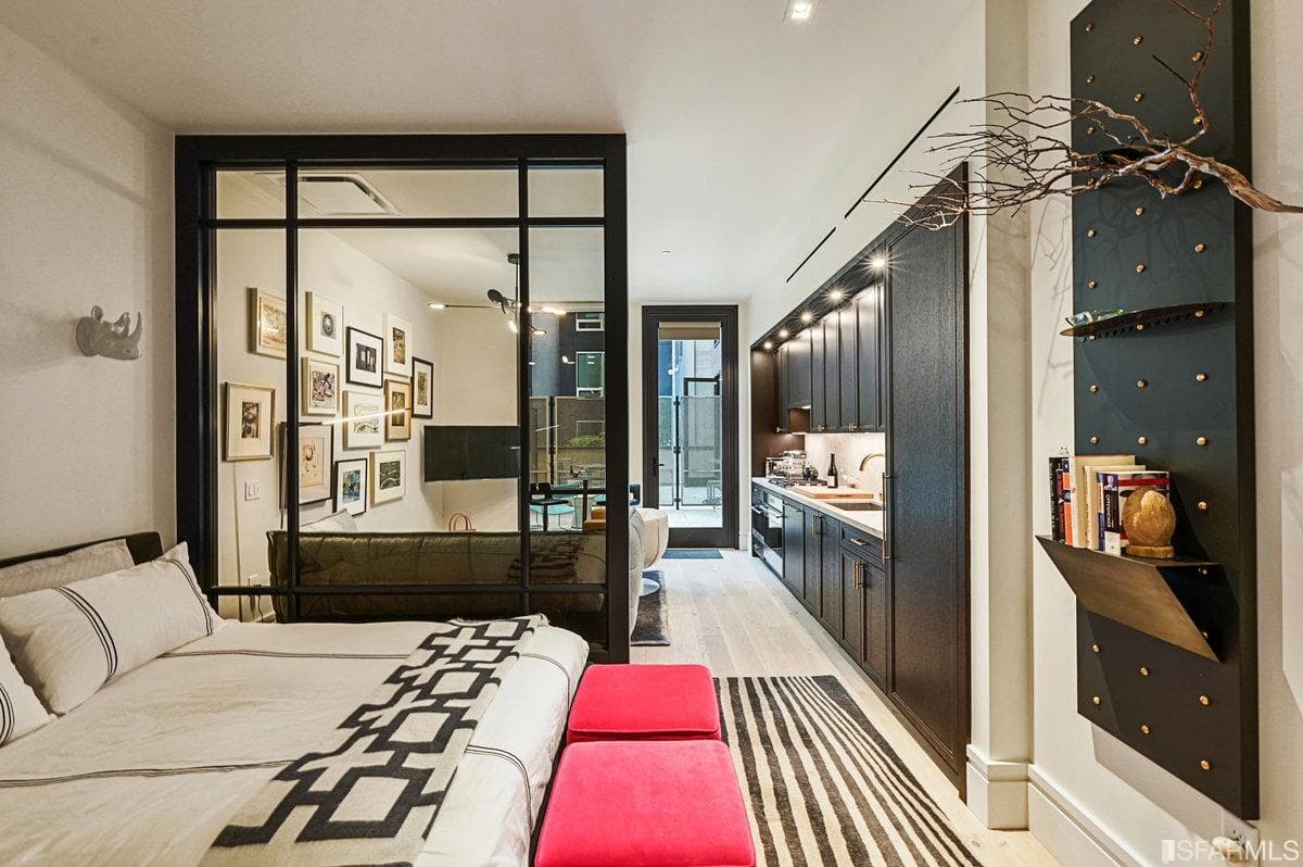 Wide plank floorings and a contrasting color palette work together to showcase a modern and elegant interior design. 