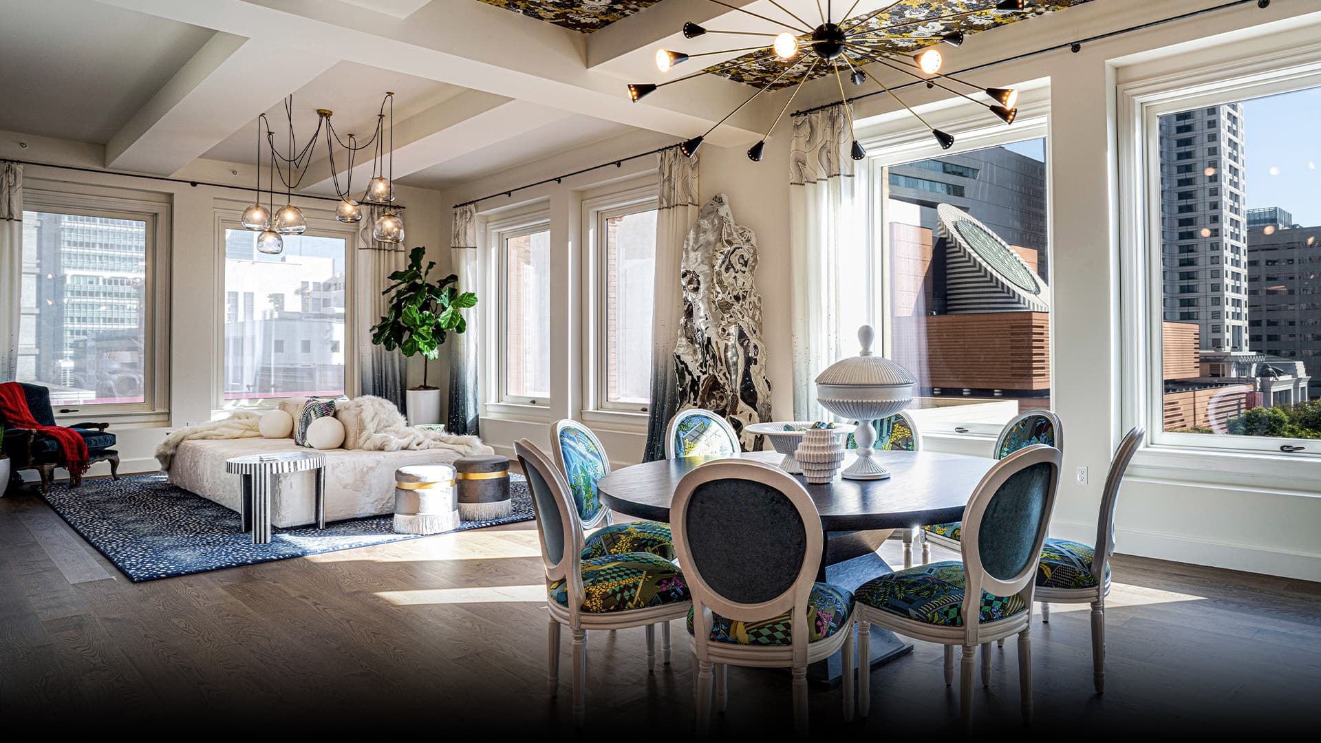 The living rooms, with high ceilings, wood and stone finishes, and an open floor plan, are capacious and elegant in appearance. Their dark color palette boasts an opulent design that is aesthetically pleasing and classy. 