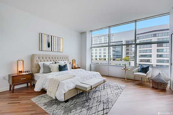 The bedrooms in The Glassworks have hardwood floors, high ceilings, expansive windows, and a vast amount of space.