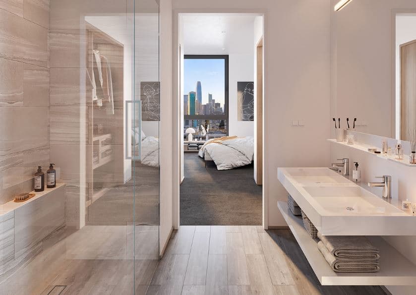 The bathrooms in Maison a Soma are designed with a custom vanity and mirror cabinet in oak finish, as well as porcelain tiles and stone wall tile. 