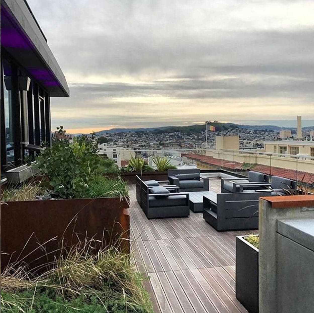 The terrace at the Rowan has panoramic views of the city, with amicable seating for relaxation and enjoyment. 