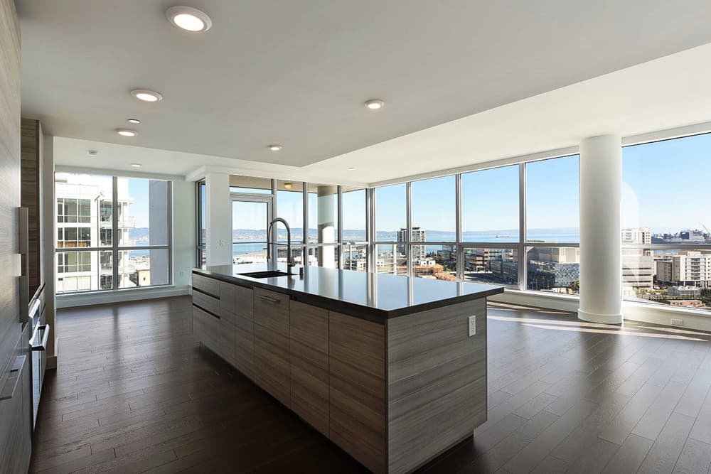 Large windows, hardwood flooring, and sleek kitchen design allow for a contemporary, upscale experience in residences of Arden. 