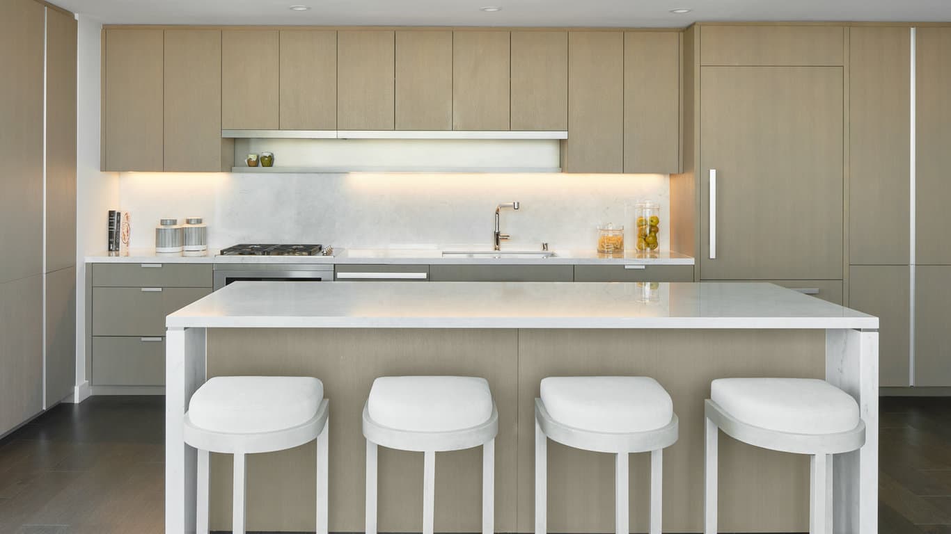 The kitchens in the Avery are complete with custom cabinetry and marble countertops that are clean, contemporary, and classy. Photo courtesy of The Avery website. 
