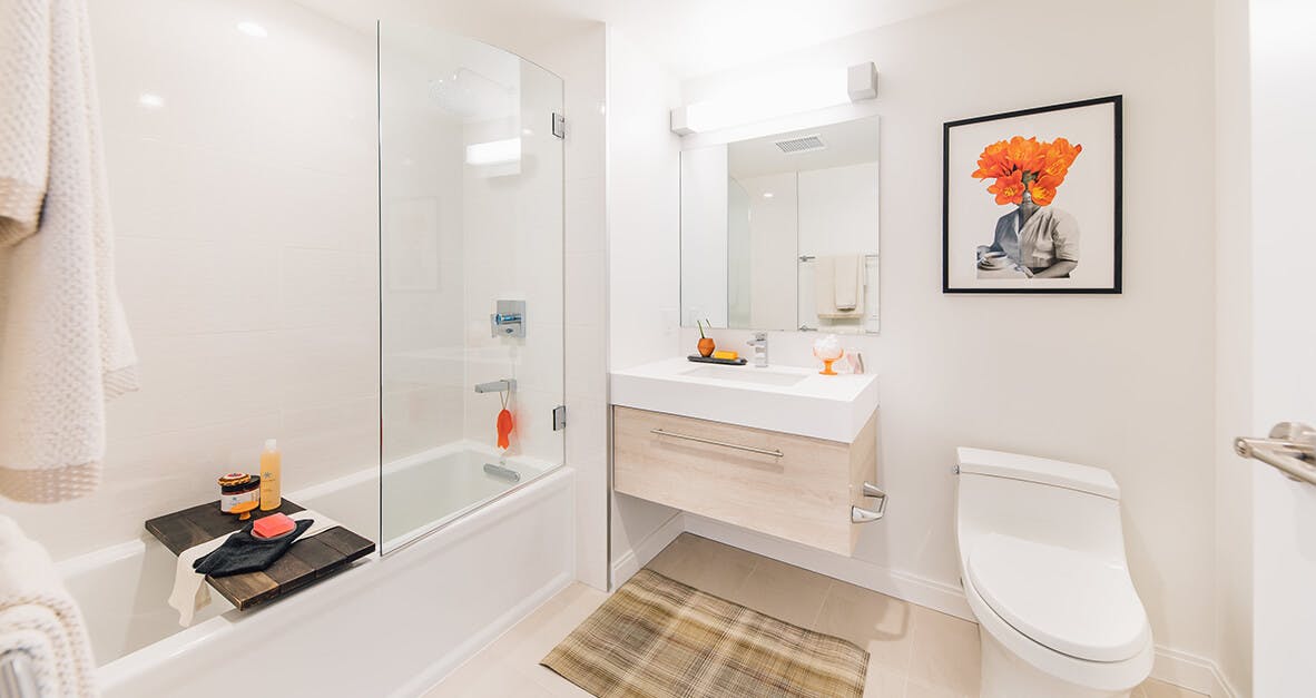 With a shower-over-bath design, tiled flooring, and natural color palette, the bathrooms are designed to be contemporary and relaxing. 