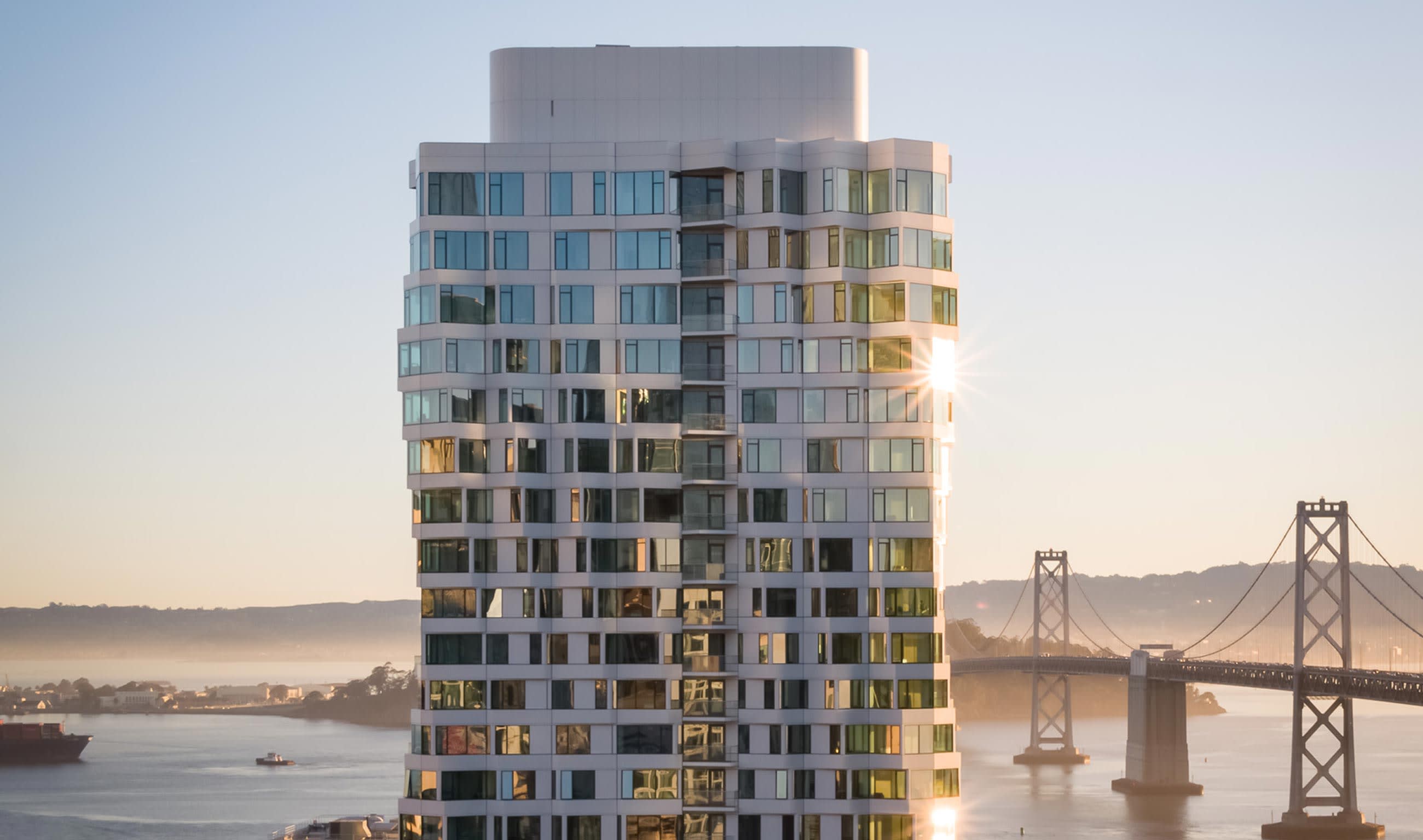 MIRA Tower is an architects dream that utilizes its design to the fullest by providing breathtaking views around the entire structure. It stands tall above the bay with its contemporary design and appearance. Photo courtesy of the MIRA website.