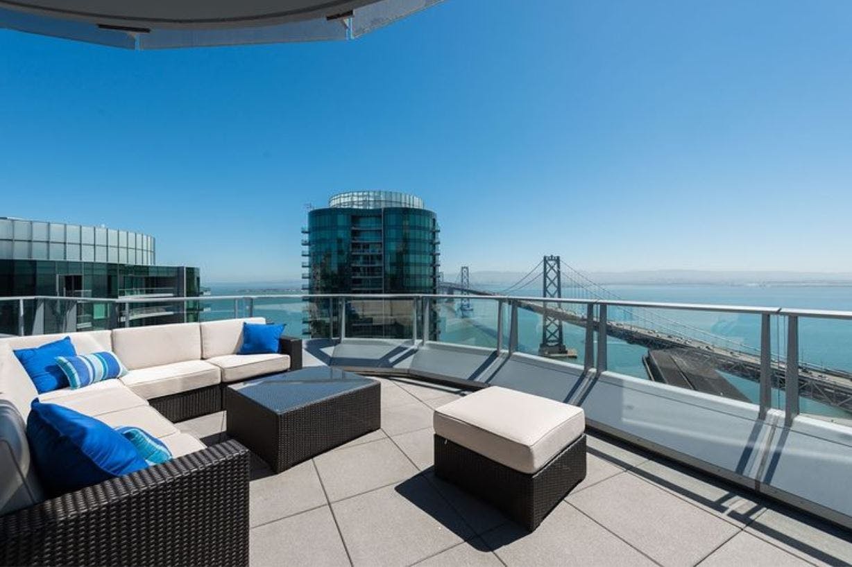 The rooftop terrace at the Lumina is 10,500 square feet and equipped with dining areas, firepits, barbecues, vegetable gardens, and a movie lawn.