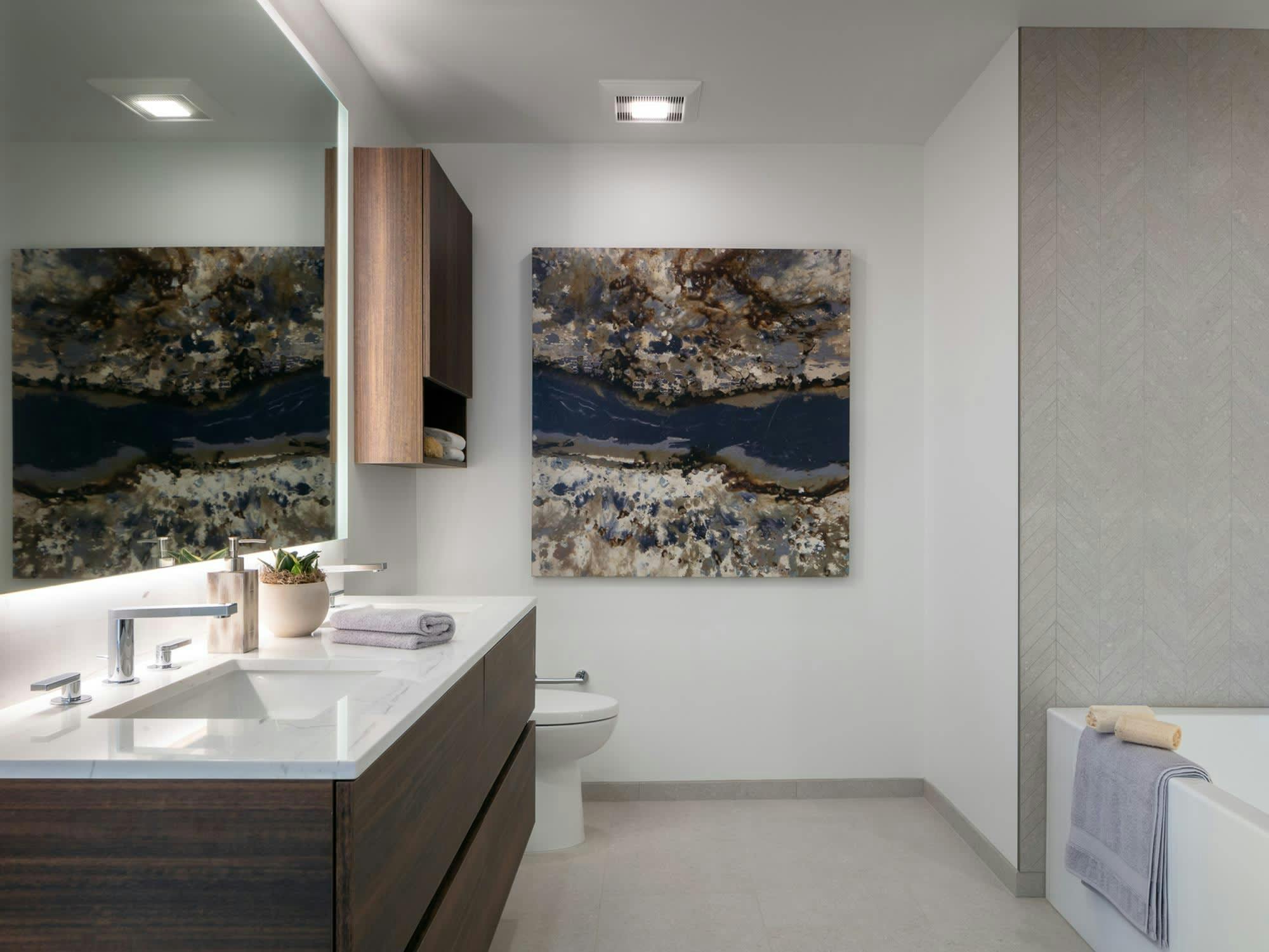 The bathrooms for residences are chic, elegant, and contemporary. With floating vanities, marble countertops and Italian tile, they speak of nothing if not designer. Photo courtesy of the MIRA website. 