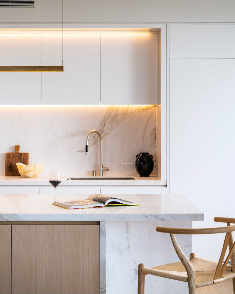 The expertly designed kitchens of One Steuart Lane are contemporary and sleek with marble counter tops and gooseneck faucets. 