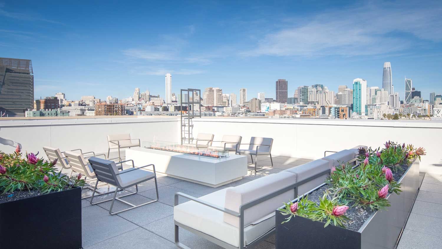 The structure boasts a rooftop terrace that includes immaculate city views paired with plenty of lounge seating and a firepit. 