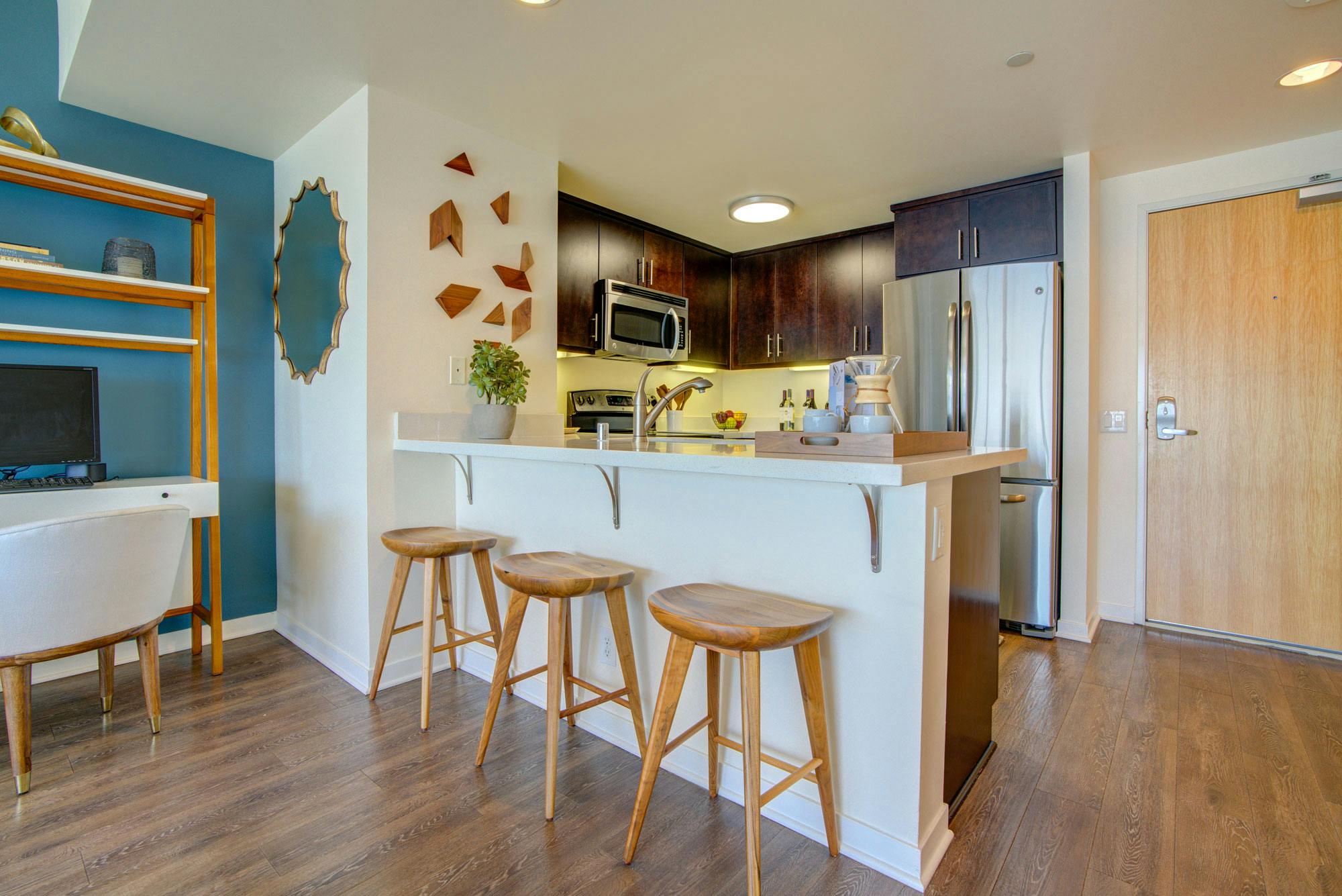 The kitchens in The Towers are adorned with hardwood flooring, smooth, classy countertops, and well-designed cabinetry.