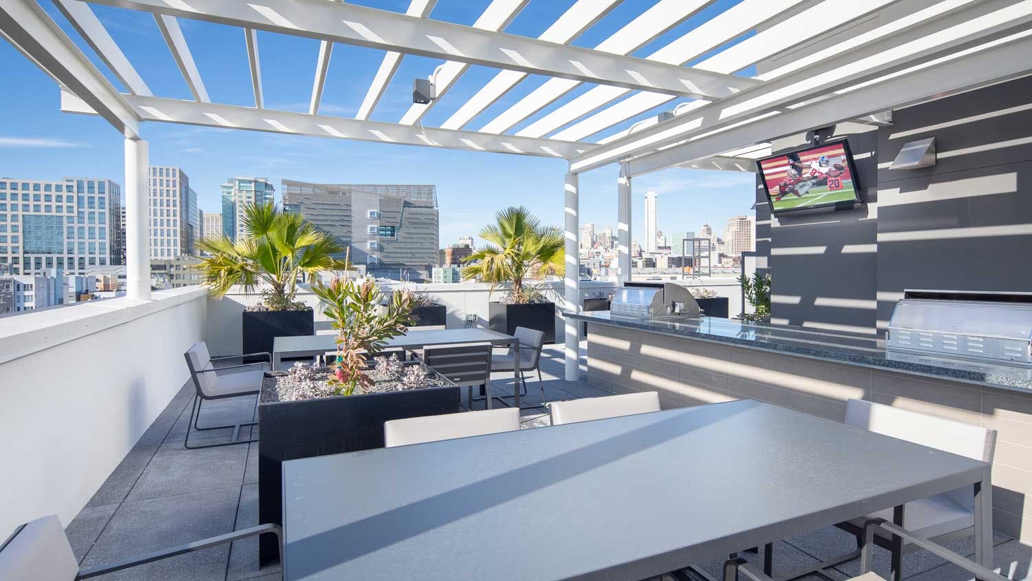The terrace provides a perfect space for entertainment or gathering, complete with barbecue and dining spaces. 