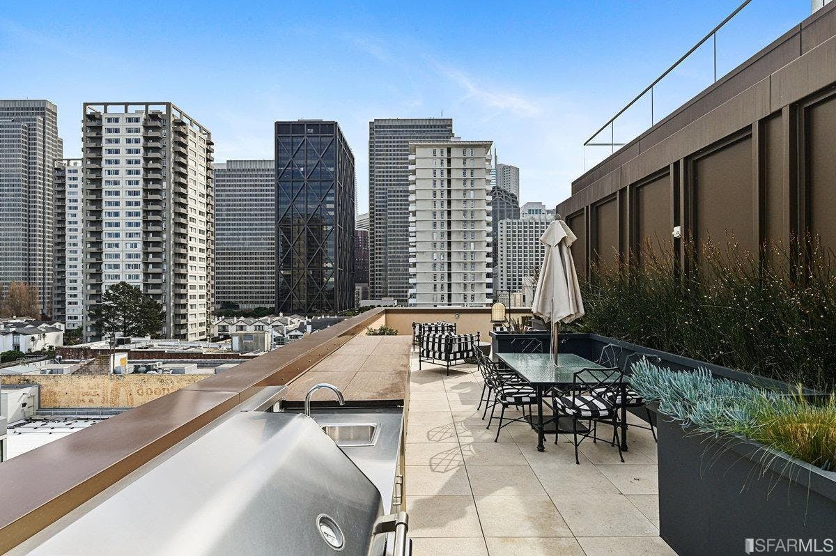288 Pacific has two rooftop terrace, one of which has a firepit, outdoor kitchen, wet bar, and dining table. 