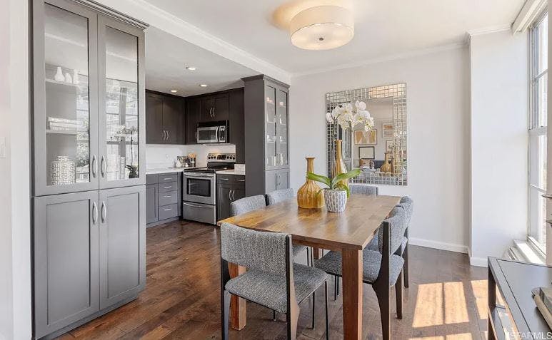 Not only does the hardwood extend into the kitchen from the living area, but kitchens are also adorned with stainless steel appliances and in-unit dishwashers. 