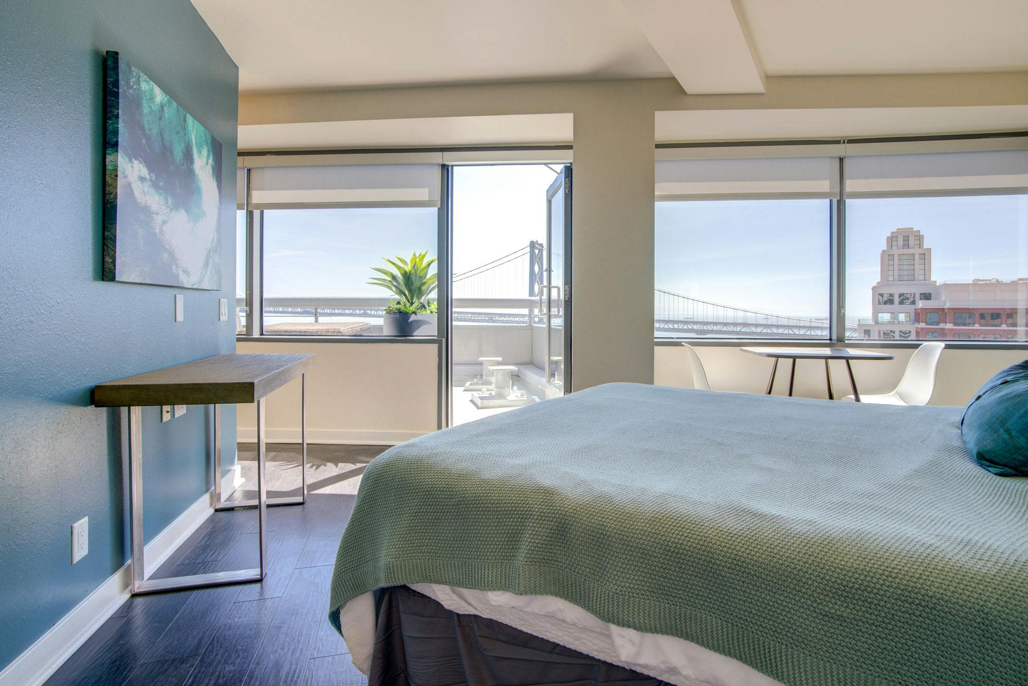 With access to a balcony and great views, the master bedroom in many units of One Rincon Hill are lavish, capacious, and stylish. 